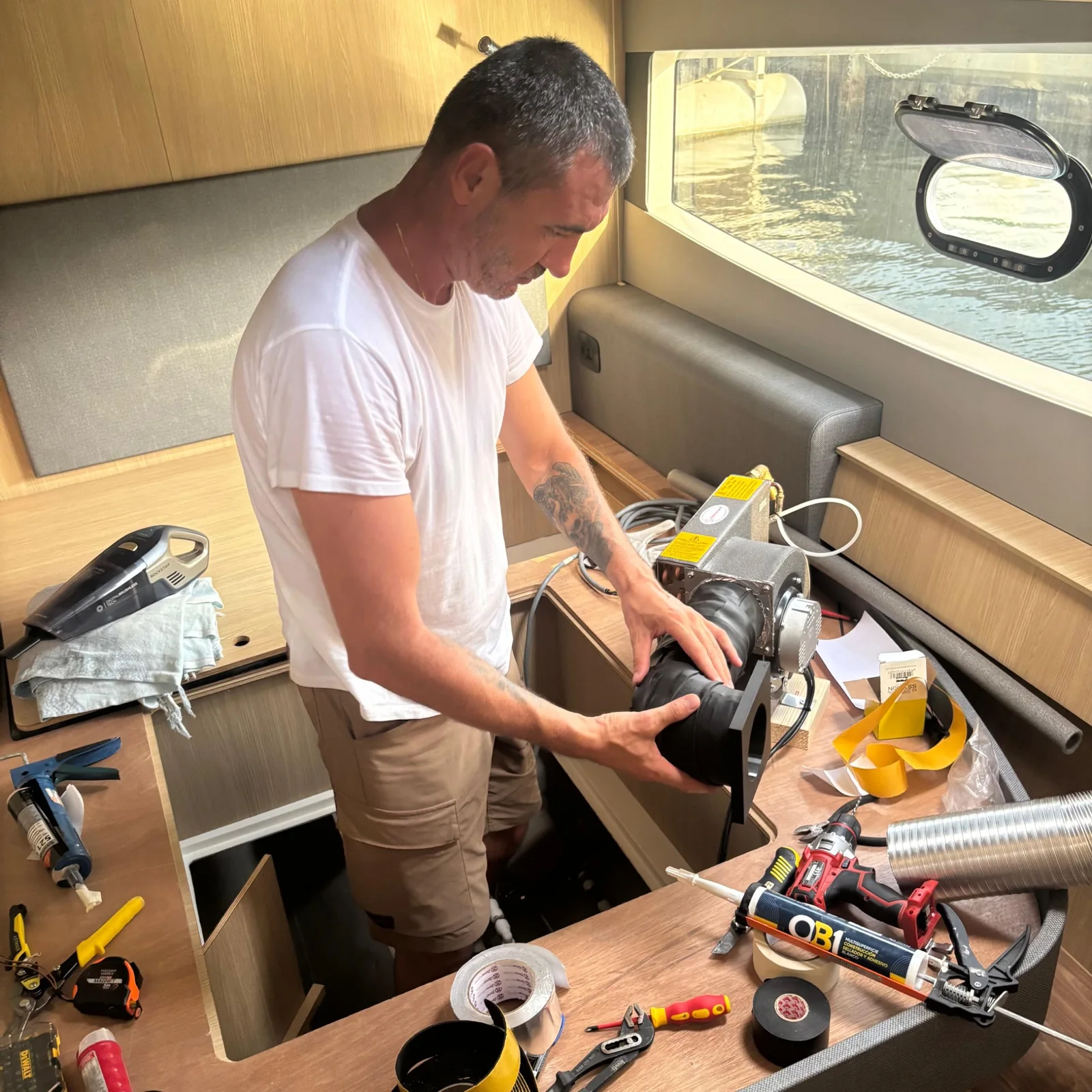 Technician installing a boat climate system